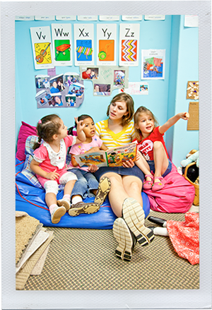 Photograph: A child care worker reads to a group of preschoolers. (Photograph by Alex Lazara)