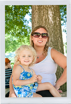 photograph of child and program personnel