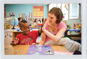 photograph of child and program personnel