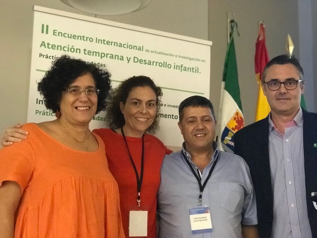 Photograph: Four attendees smiling together at the 2018 2nd International Meeting on latest trends and research in early intervention and child development in Merida, Spain.